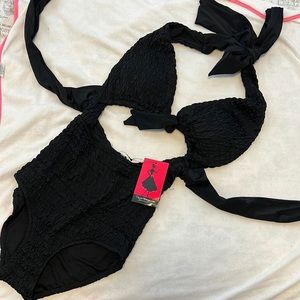 Unique vintage one piece black swimsuit.
